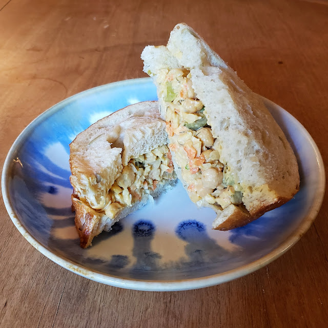 Chickpea salad sandwiches on a handmade plate