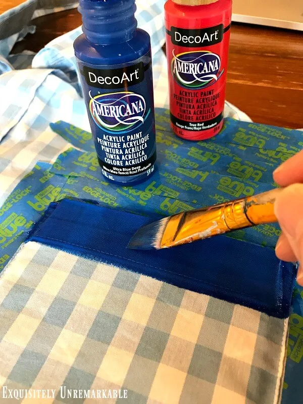 Painting the blue stripe on the top a shirt pocket