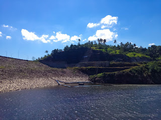 Lake Water Of Dam And The Cliff Hill Of Titab Ularan Dam Landmark On A Sunny Day In The Dry Season North Bali Indonesia