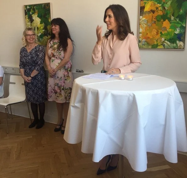 Crown Princess Mary wore Diane Von Furstenberg Tailored Asymmetric Overlay Skirt. The Danish Women's Society and The Mary Foundation.