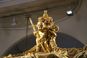 herubs on the roof of the Gold State Coach at the Royal Mews, Buckingham Palace