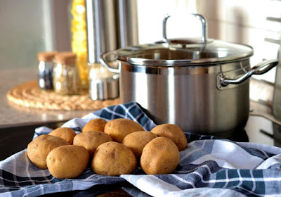 Potatoes in front of a pot