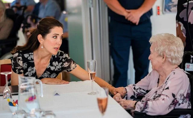 Crown Princess Mary wore a new floral wrap dress from Ralph Lauren, and Gianvito Rossi pumps, Dulong Esme bracelet, Cartier Love Bracelet