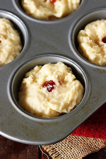 Buttermilk Jam Muffins Batter with Dot of Raspberry Jam on Top Image