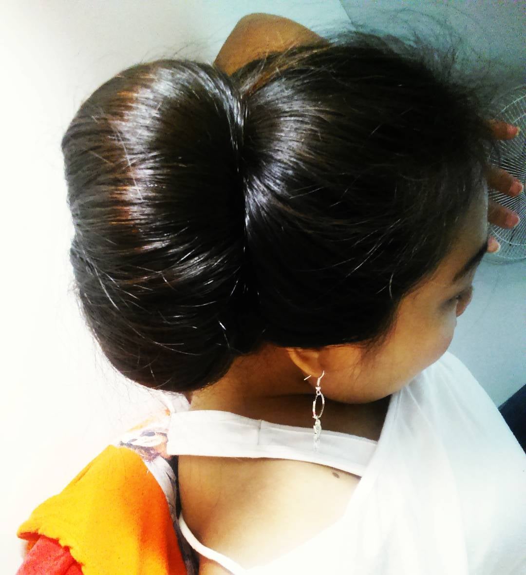 Bengali girl's bright black long hair style Traditional kondai hair