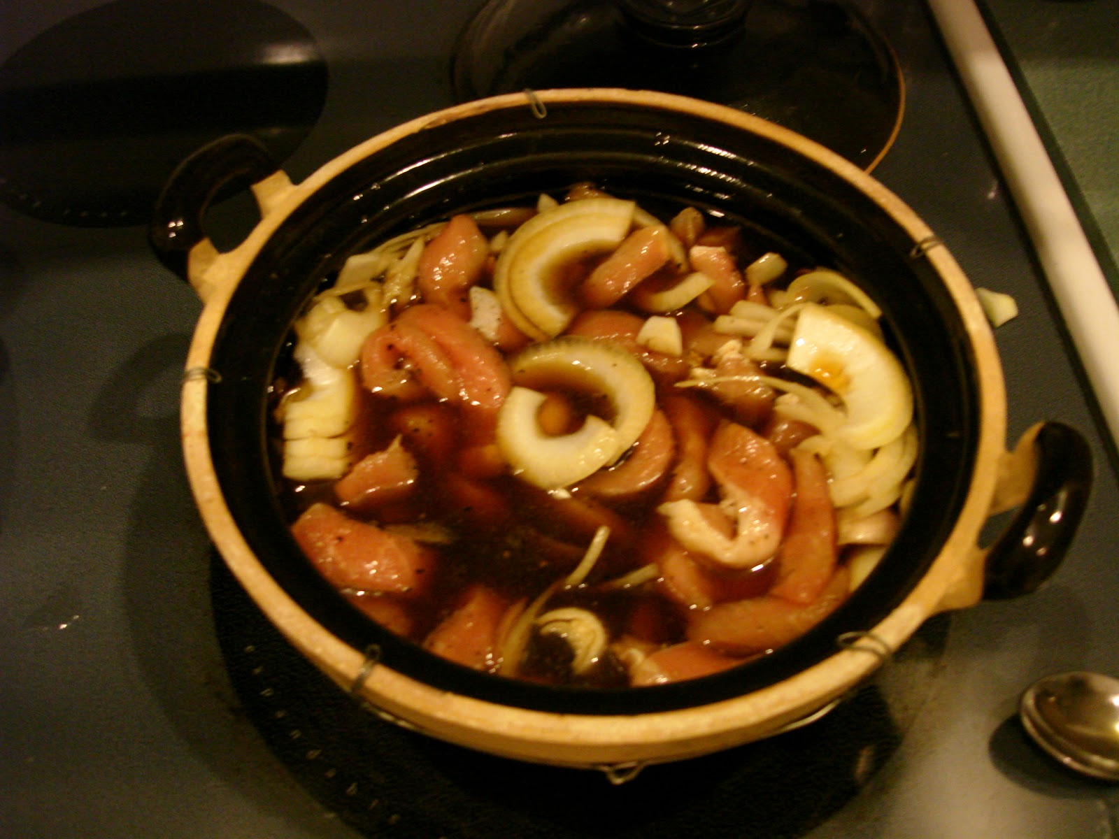 Cleaver Chops Vietnamese pork in a clay pot