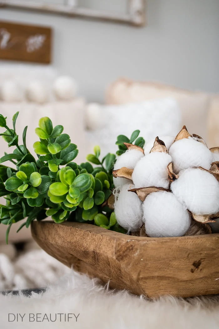 wood dough bowl with cotton and greenery