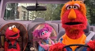 Louie, Elmo and Abby Cadabby are chatting in a car. Sesame Street Elmo's Travel Songs and Games