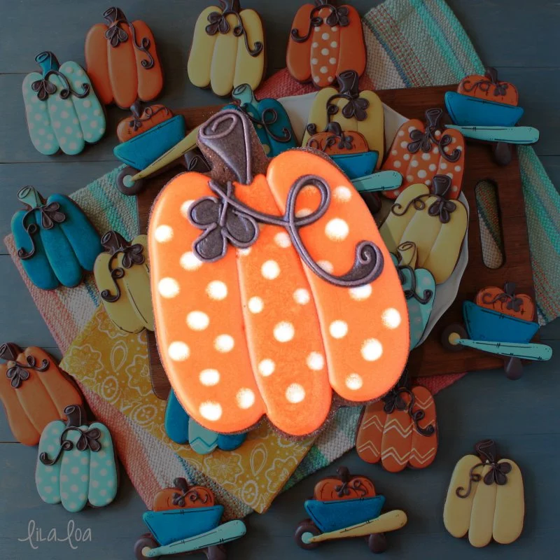 polka dot pumpkin decorated chocolate sugar cookie for fall