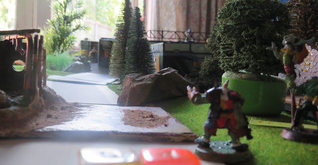 An ork looks down the road