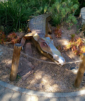 scary bronze metal alligagot croc crocodile sculpture art statue at Denver Zoo entrance Colorado