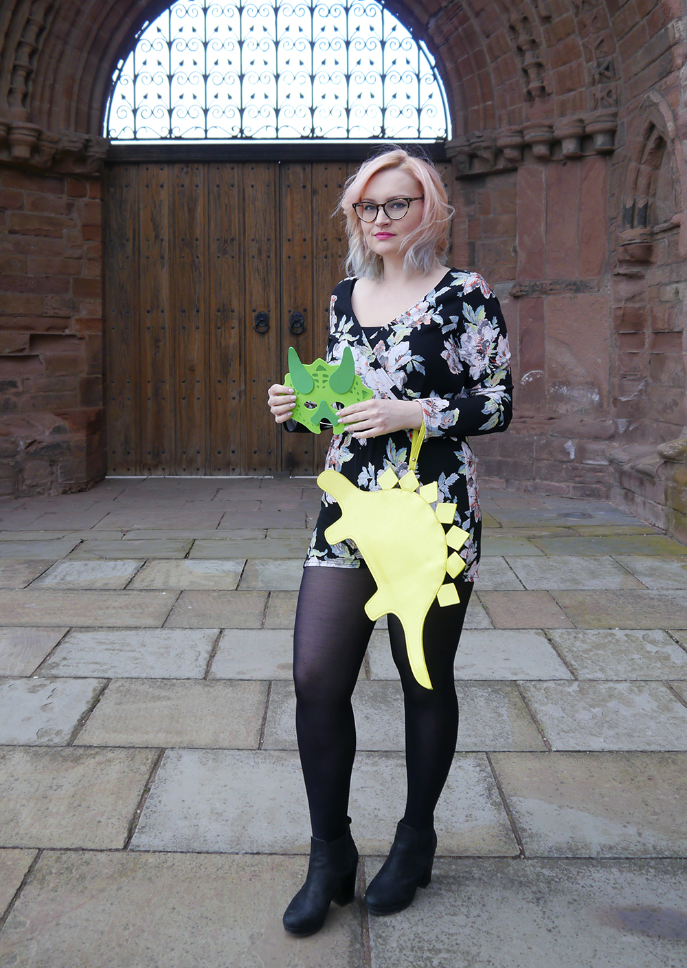 A dinosaur themed outfit by Scottish style blogger Wardrobe Conversations in Angus dinosaur themed fashion shoot, Arbroath Abbey, floral Boohoo jumpsuit, pnk and blue ombre hair DIY,