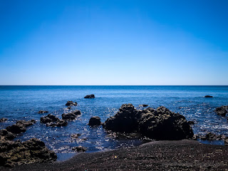 Calm Sea Water Wave Of Tropical Rocky Beach In The Clear Blue Sky On A Sunny Day At Umeanyar Village North Bali Indonesia