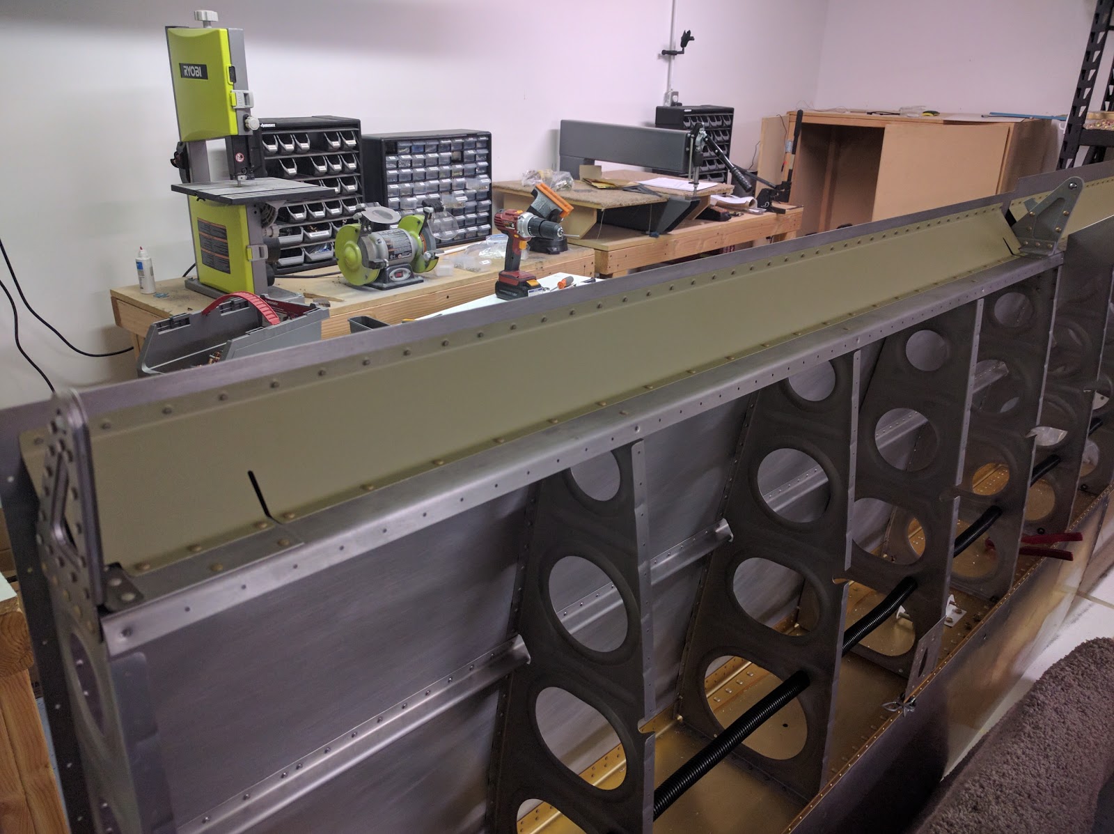 Damazio family's RV10 project Bottom wing skins drilling and fairing