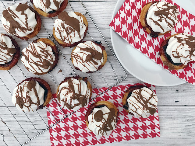 Jam tarts topped with meringue and messy chocolate