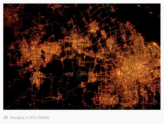 nighttime view from above of urban areas