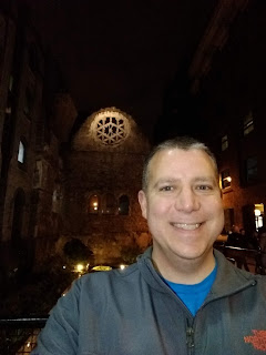Jerry Yoakum photoed in front of the ruins of Winchester Palace in London, England.