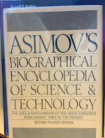 Asimov's Biographical Encyclopedia of Science & Technology, superimposed on Intermediate Physics for Medicine and Biology.