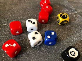 The custom dice from The Walking Dead: All Out War miniatures game