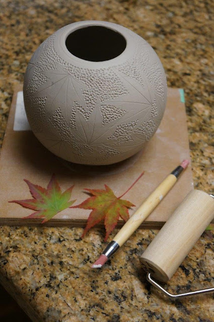 Beautiful nature inspired leaf imprint ceramic pottery hand thrown vessel - in progress.