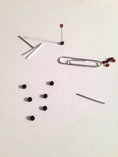 tiny coils as quilled cello pegs