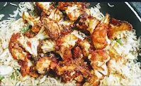 Adding fried cauliflower florets with rice for cauliflower Manchurian fried rice recipe