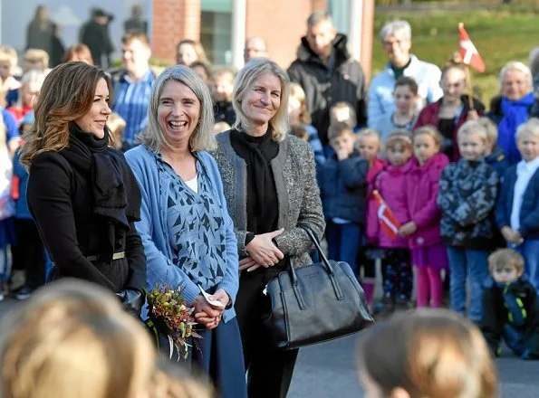 Crown Princess Mary visited Gistrup Nøvling School and at meeting of School Leaders. wore printed skirt and coat