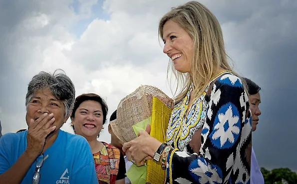 Queen Maxima, is greeted by the Garcia Family