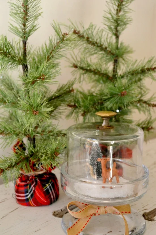 winter scene snow globes on DIY candle stick pedestals www.homeroad.net