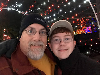 A photo of David Brodosi and his son enjoy the holiday lights