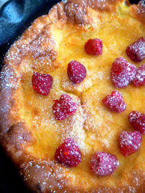 Lemon Raspberry Dutch Baby: A tender, eggy, over-sized pancake laced with bright lemon and topped with tart fresh raspberries.   As wonderful to eat as it is spectacular to look at, no one has to know how easy this is to make! - Slice of Southern