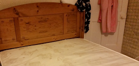 My pine bed frame with a new mattress on.