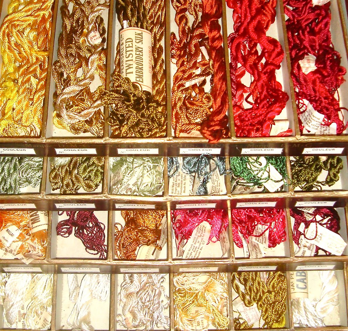 Interesting Antique Textiles A vintage shop display box of embroidery