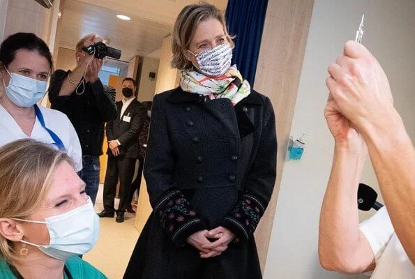 Princess Delphine of Belgium visited the Saint-Pierre Hospital, which was organizing its Vaccine Day event. Embroidered sleeve wool coat