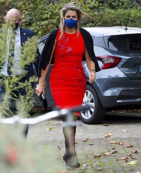 Queen Maxima wore a short sleeve red midi dress from Natan Edouard Vermeulen Fall-Winter 2016 collection