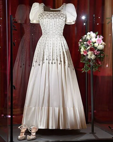 Princess Beatrice wore The Vampire's Wife's floral print silk midi dress, Princess Beatrice’s wedding shoes, made by Valentino. wedding dress