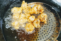 Deep frying lobster meat pieces for lobster hot garlic sauce