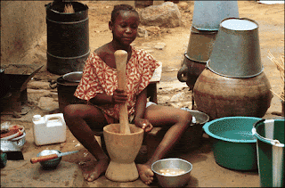 Using a mortar and pestle in Mali, Africa photo by L. Lee McIntyre