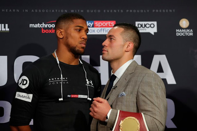 Britain's Anthony Joshua (L) and New Zealand's Joseph Parker (R) 