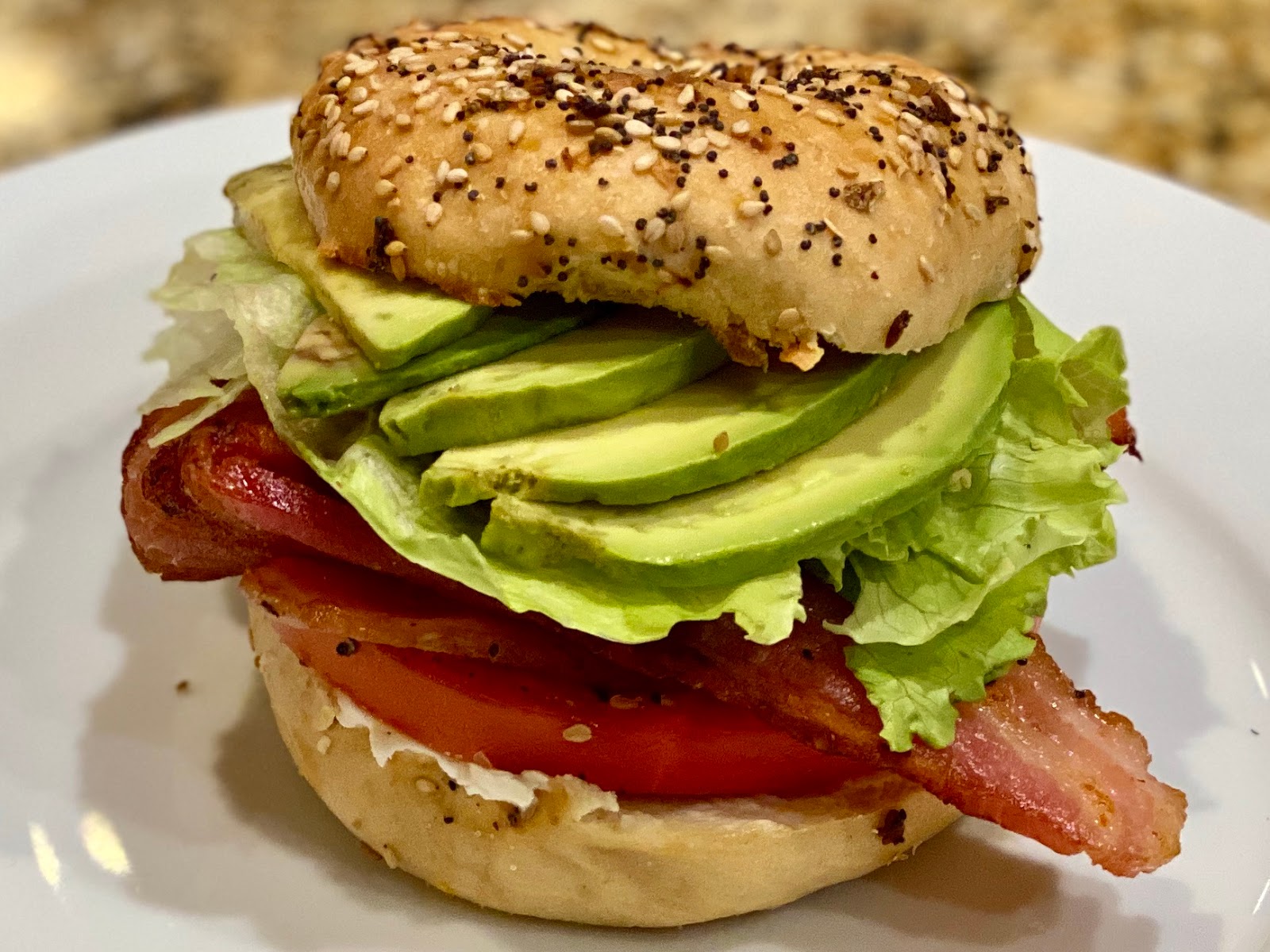 GREAT EATS HAWAII BLT ON A BAGEL WITH CREAM CHEESE AND AVOCADO