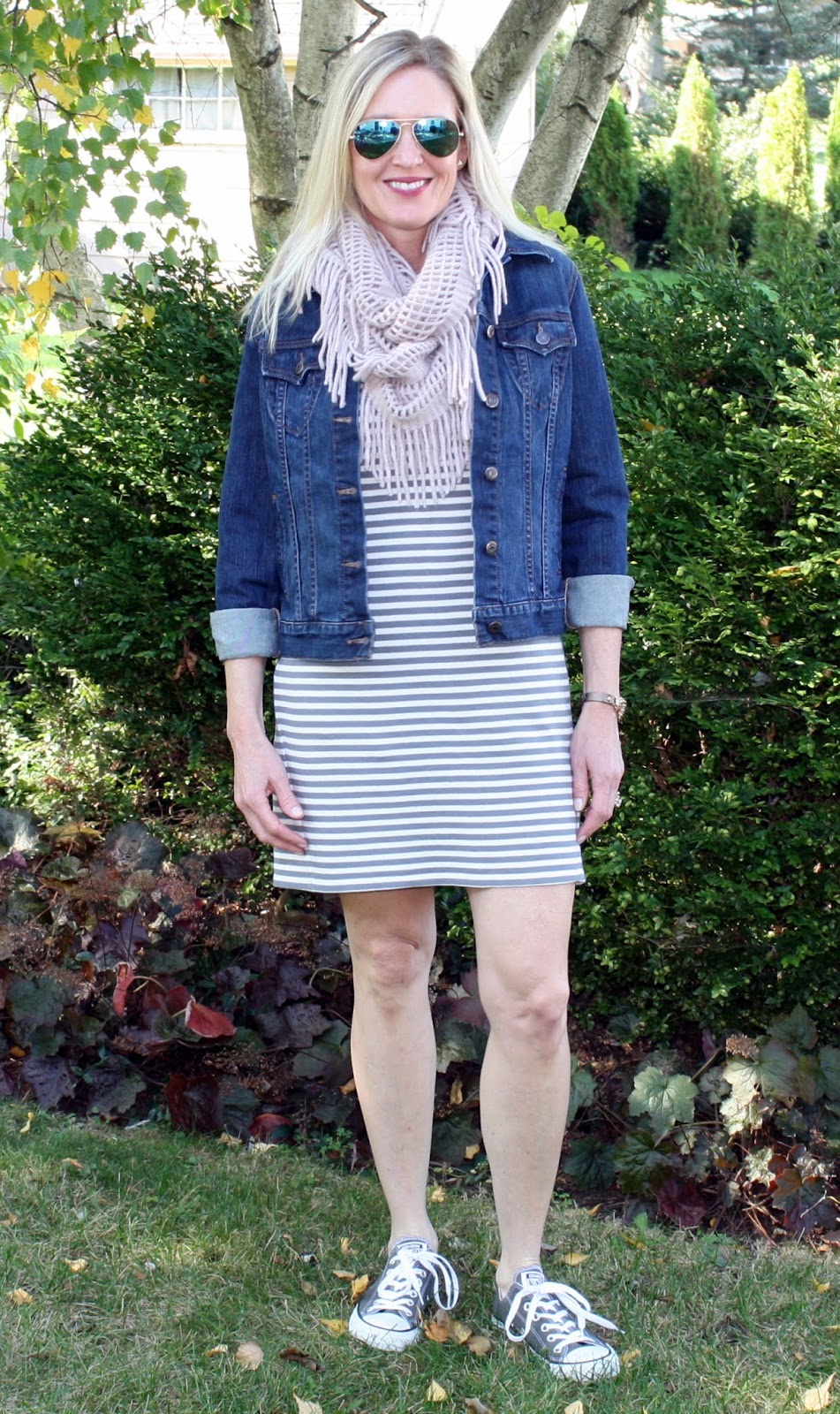 Everyone needs a striped dress in their wardrobe. Inspiration on how to wear a striped dress three ways!