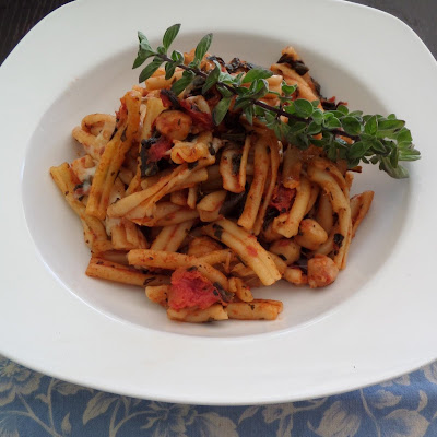 Spinach Pasta Bake:  A vegetarian one dish meal of pasta and tomato sauce, with spinach and garbanzo beans, baked with mozzarella.