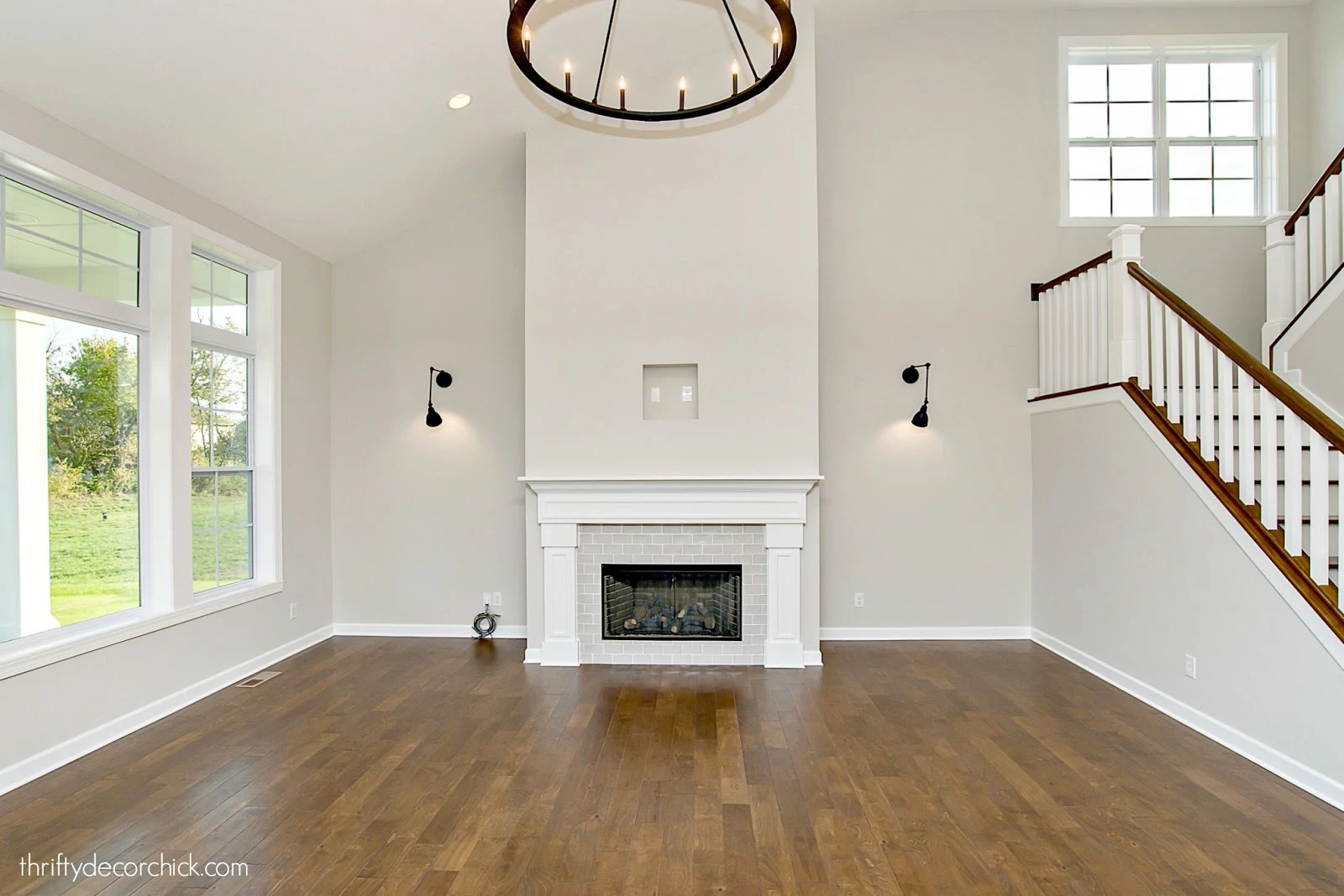Two story fireplace in family room open stairs