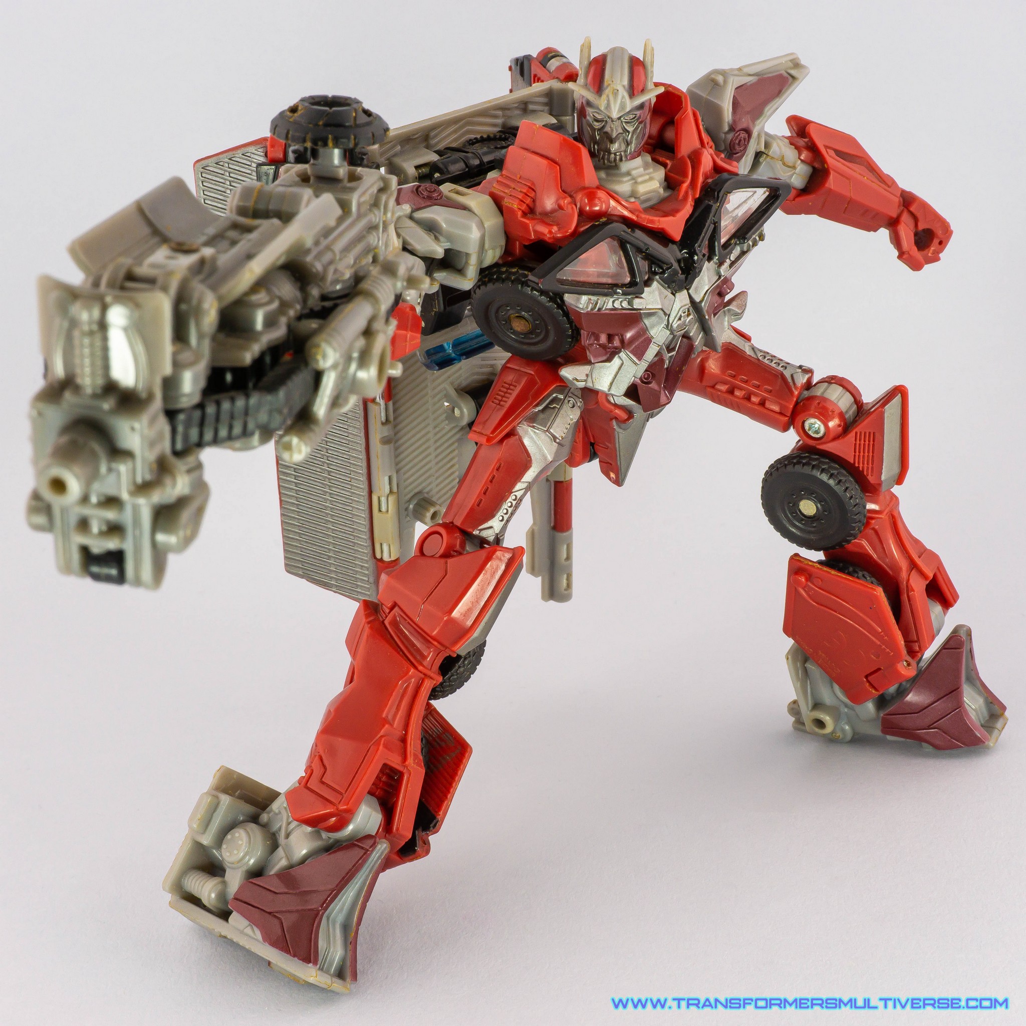 Transformers Dark of the Moon Sentinel Prime posed with MechTech rifle