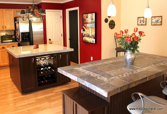 red kitchen with granite and slate countertops