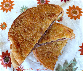 Grilled Nutella Crunch Sandwich, a crispy crunchy ooey gooey nutella sandwich dipped in a crunchy topping and grilled in a saute pan | Recipe developed by www.BakingInATornado.com | #recipe #sandwich