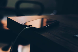 https://www.pexels.com/photo/shallow-focus-photography-of-black-iphone-7-on-brown-wooden-table-1202575/