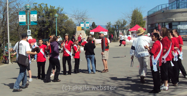 The enthusiastic volunteers greet the walkers with cheers.