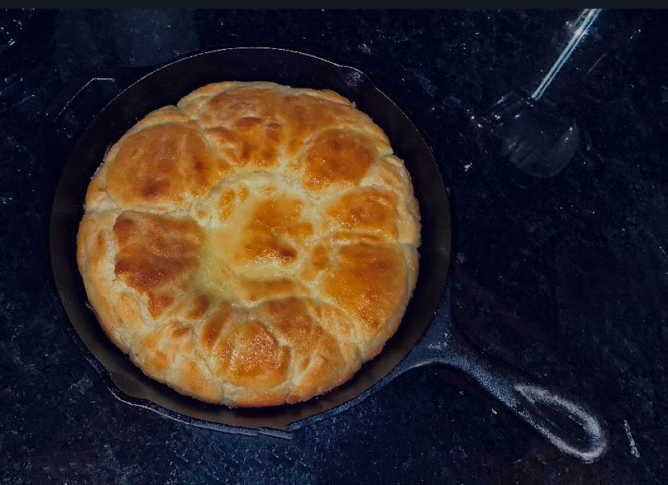Cast iron skillet butter topped drop biscuits