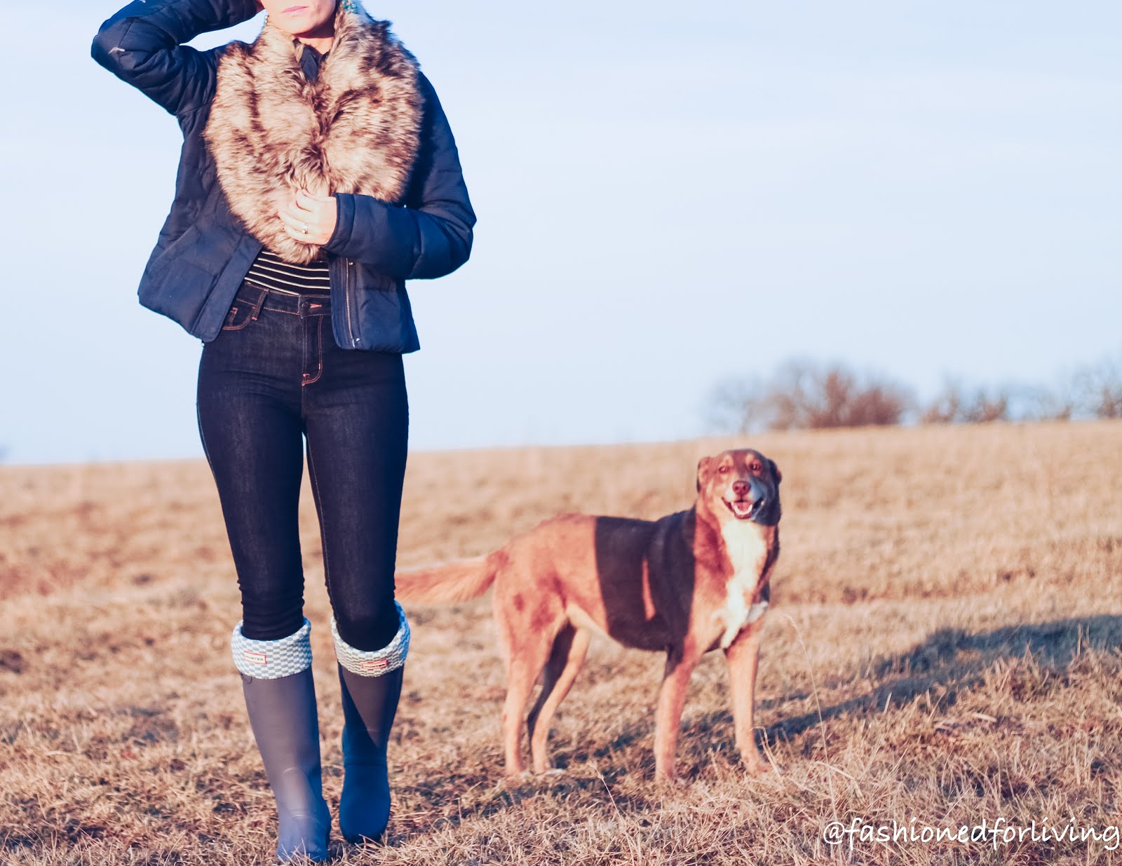 Fashioned For Living Hunter Boots Outfit With Faux Fur High Waisted Jeans And Blue Puffer Coat